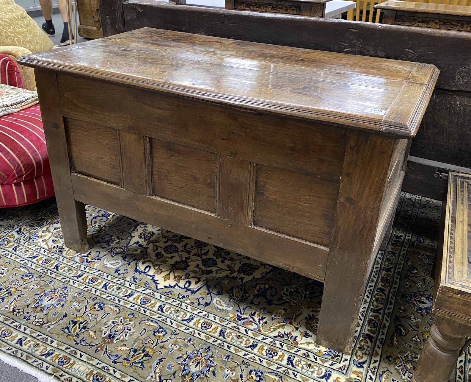 An early 18th century French oak coffer, with a triple panelled front, width 111cm, depth 62cm, height 69cm